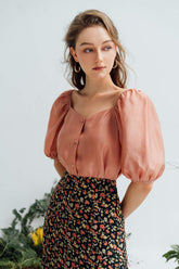 Silk puff-sleeve blouse with square neckline and front buttons for an elegant silhouette
